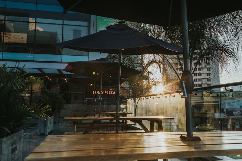 Outdoor restaurant patio with tables and umbrellas